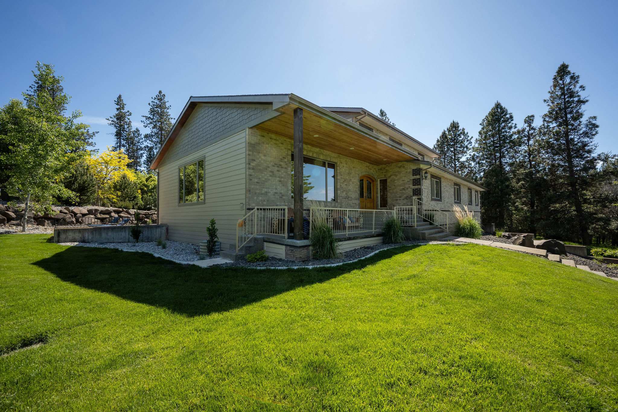 Maintained green lawn surrounding a North Idaho home