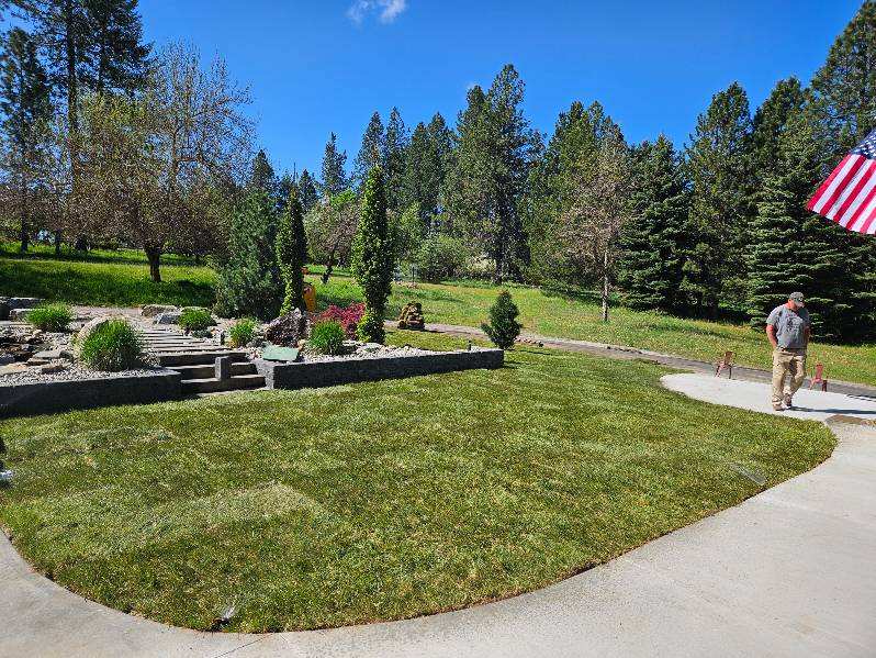 Finished Coeur d'Alene property with lawn, sprinkler system and retaining wall installed by CDA Landscape Guy